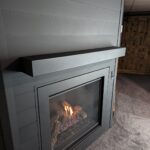 aluminum-shiplap-fireplace-lit